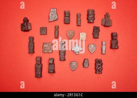 Set of statues tiwanaku on red background with top view Stock Photo