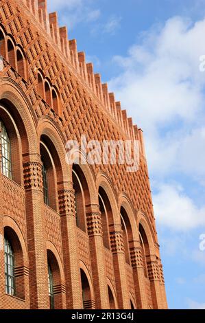 Architectural details of Michelet Center Art and Archeology library of Sorbonne University. Paris, France. Red brick wall, window archs and roof. Stock Photo