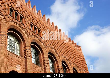 Architectural details of Michelet Center Art and Archeology library of Sorbonne University. Paris, France. Red brick wall, window archs and roof. Stock Photo