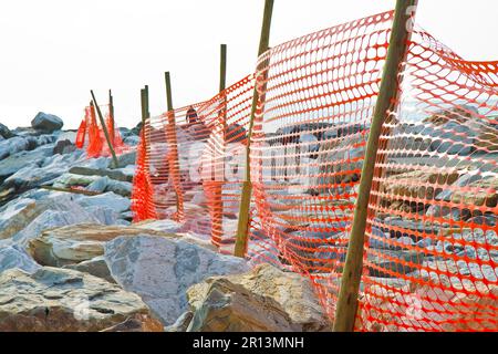Safety plastic orange grid in a construction site - building activity Stock Photo
