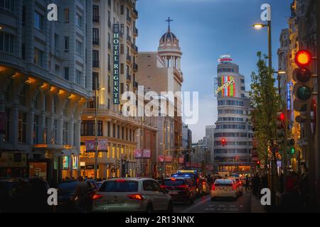 Illuminated Gran Via Street with Edificio Capitol (or Carrion) Building and Schweppes neon sign - Madrid, Spain Stock Photo
