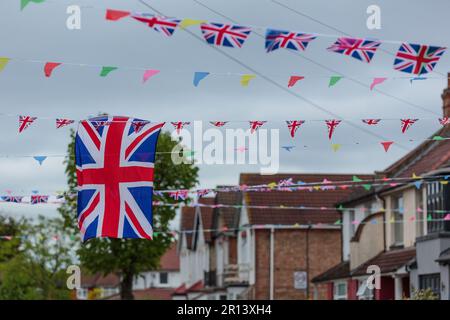 Wembley, Middx, UK. Coronation Street Party. A residential road in Wembley UK decorated with colourful Union Jack bunting and flags in preparation for Stock Photo