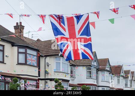 Wembley, Middx, UK. Coronation Street Party. A residential road in Wembley UK decorated with colourful Union Jack bunting and flags in preparation for Stock Photo