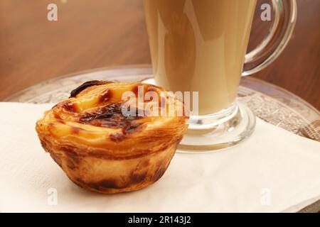 Close up of a Pastel de Nata and coffee, Portuguese Custard Tarts Stock Photo