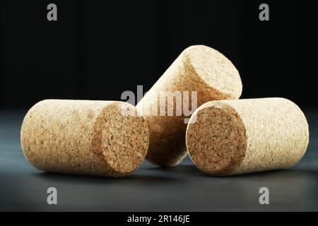 Corks of wine bottles on grey table, closeup Stock Photo