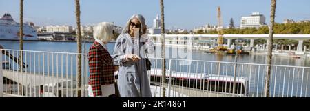 Shot of adult modern women resting outdoors Stock Photo