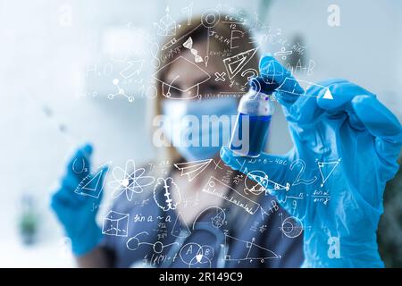 science, research and chemistry concept - young scientist in safety glasses with test tube and virtual projection of chemical formula. Stock Photo