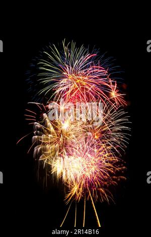 Bright and colorful fireworks on black background. Background for birthday celebrations, big events and parties Stock Photo
