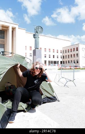 Unity in Protest: Students of Sapienza University in Rome share a moment of camaraderie in their encampment during a protest against rising rental. Stock Photo