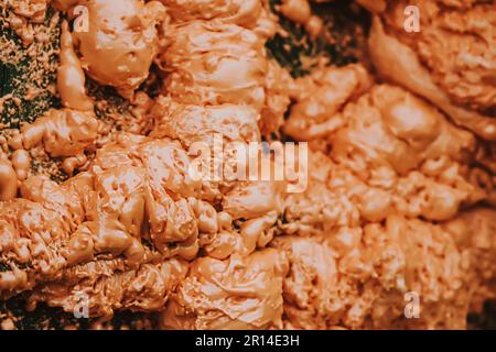 Spraying foam texture. Polyurethane foam close up. Stock Photo