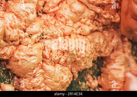 Spraying foam texture. Polyurethane foam close up. Stock Photo