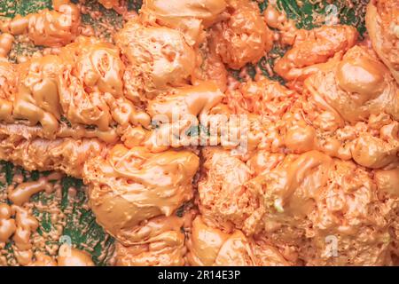 Spraying foam texture. Polyurethane foam close up. Stock Photo