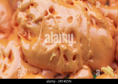 Spraying foam texture. Polyurethane foam close up. Stock Photo