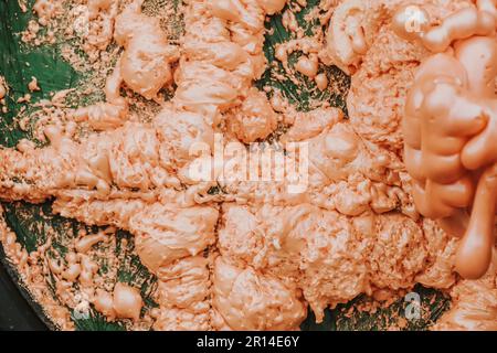 Spraying foam texture. Polyurethane foam close up. Stock Photo