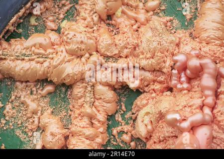 Spraying foam texture. Polyurethane foam close up. Stock Photo