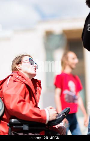 Unity in Protest: Students of Sapienza University in Rome share a moment of camaraderie in their encampment during a protest against rising rental. Stock Photo