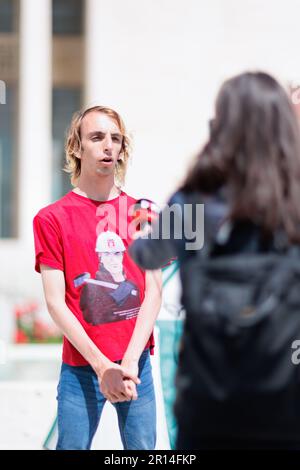 Unity in Protest: Students of Sapienza University in Rome share a moment of camaraderie in their encampment during a protest against rising rental. Stock Photo