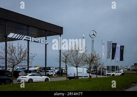 Wroclaw, Poland - April 4, 2023: Banner flags and Mercedes logo in front of AMG company building. Stock Photo