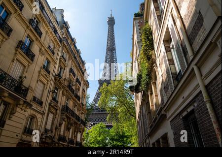 The Eiffel Tower view between palaces in Rue de l'Universite street, 7th arrondissement, Paris, France Stock Photo