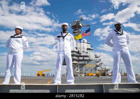 Norfolk, Virginia, USA. 2nd May, 2023. Sailors assigned to the first-in-class aircraft carrier USS Gerald R. Ford (CVN 78) man the rail on the flight deck, May 2, 2023. Gerald R. Ford is the flagship of the Gerald R. Ford Carrier Strike Group. As the first-in-class ship of Ford-class aircraft carriers, CVN 78 represents a generational leap in the U.S. NavyÃs capacity to project power on a global scale. Credit: Nolan Pennington/U.S. Navy/ZUMA Press Wire Service/ZUMAPRESS.com/Alamy Live News Stock Photo