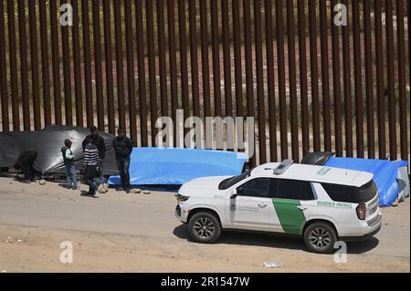 Tijuana, Mexico. 11th May, 2023. Migrants stuck between the primary and secondary fencing at the Tijuana-San Diego border for over a week, are waiting and hoping to be allowed to immigrate to the U.S. more easily after the 'Title-42' deportation order expires on May 11, as seen from Tijuana, Mexico on Thursday, May 11, 2023. Photo by Carlos Moreno/UPI Credit: UPI/Alamy Live News Stock Photo