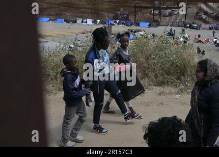 Tijuana, Mexico. 11th May, 2023. Migrants stuck between the primary and secondary fencing at the Tijuana-San Diego border for over a week, wait and hope to be allowed to immigrate to the U.S. more easily after the 'Title-42' deportation order expires on May 11, as seen from Tijuana, Mexico on Thursday, May 11, 2023. Photo by Carlos Moreno/UPI Credit: UPI/Alamy Live News Stock Photo