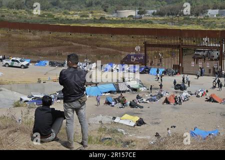 Tijuana, Mexico. 11th May, 2023. Migrants stuck between the primary and secondary fencing at the Tijuana-San Diego border for over a week, wait and hope to be allowed to immigrate to the U.S. more easily after the 'Title-42' deportation order expires on May 11, as seen from Tijuana, Mexico on Thursday, May 11, 2023. Photo by Carlos Moreno/UPI Credit: UPI/Alamy Live News Stock Photo