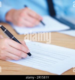 Business people, hands and writing on finance spreadsheet for accounting, budget or expenses on form. Hand of accountants working on financial report Stock Photo