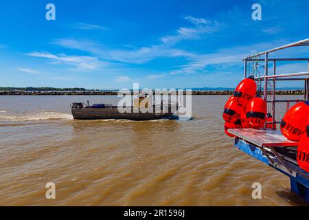 Small fishing boat heading out of Steveston Harbour British Columbia Canada Stock Photo