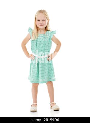 This is my best summer dress. Studio shot of a cute little girl in a frilly dress against a white background. Stock Photo