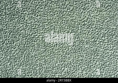 textured light green stucco wall background texture Stock Photo