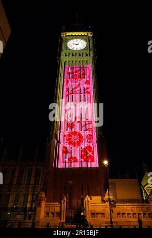 Projections on Big Ben in London to celebrate the Coronation of King Charles III - Light show on Elizabeth Tower and the Houses of Parliament in Westm Stock Photo