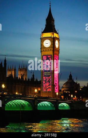 Projections on Big Ben in London to celebrate the Coronation of King Charles III - Light show on Elizabeth Tower and the Houses of Parliament in Westm Stock Photo