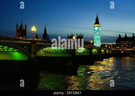 Projections on Big Ben in London to celebrate the Coronation of King Charles III - Light show on Elizabeth Tower and the Houses of Parliament in Westm Stock Photo