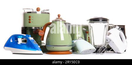 Various appliances on table isolated on white background Stock Photo