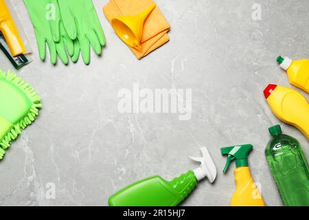 Flat lay composition with car cleaning products on light grey table ...
