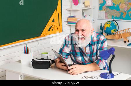 Professor is waiting for a lecture. A lesson from a fun teacher. The teacher is waiting for the students. Stock Photo