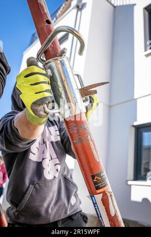 Man working on construction site, Calw, Germany Stock Photo
