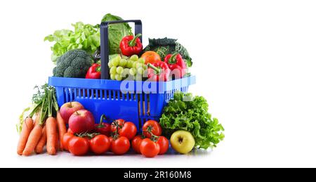 Fresh organic fruits and vegetables in plastic shopping basket isolated on white Stock Photo