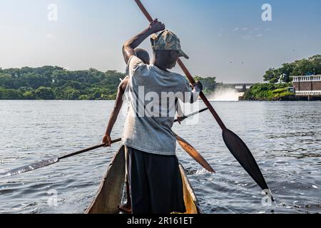 Fishermen fishing below the rapids on the Tshopo river, Kisangani, DR Congo Stock Photo