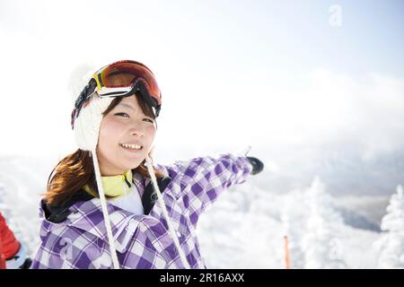 Snowy world of snow covered mountains and girls Stock Photo