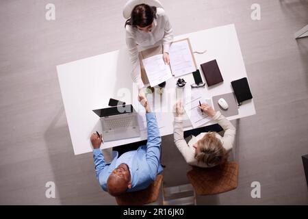 Businesspeople Shaking Hands After Interview In Office Stock Photo