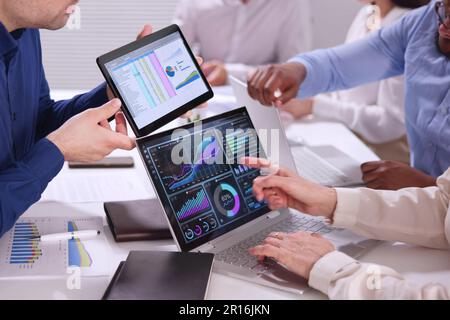 Business People Working On Dashboard Using Computer And Spreadsheet Stock Photo