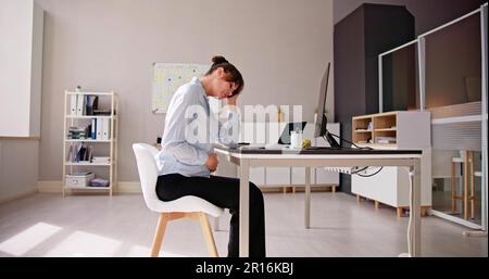 Tired Pregnant Business Woman. Business Stress At Desk Stock Photo