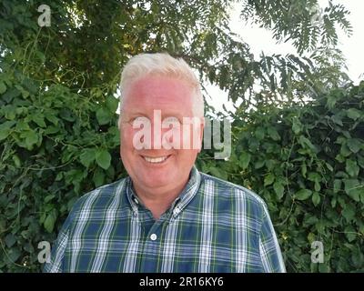 Senior blonde male in various poses Stock Photo