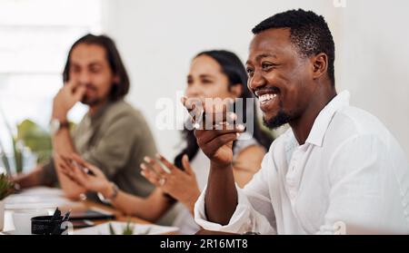 The bright ideas are flowing now. a young businessman having a meeting with his colleagues in an office. Stock Photo