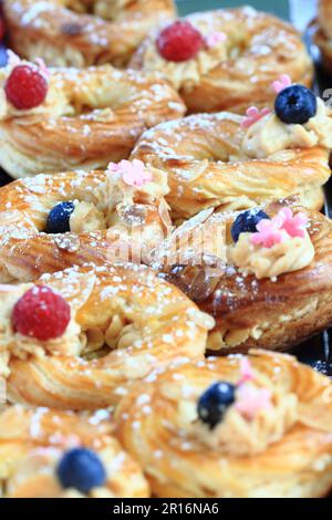cream puff with raspberries and blueberries as nice gourmet background ...