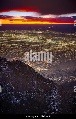 A stunning panoramic view of a city skyline illuminated by the setting sun in Albuquerque, New Mexico Stock Photo