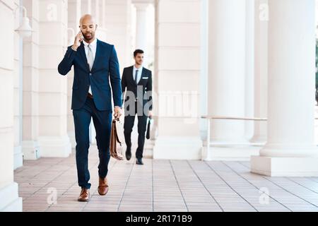 Communicating the convenient way in the city. a young handsome businessman on a call outside. Stock Photo