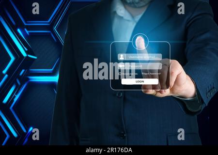 Businessman hand touching screen to login. Enter Username, Password for Login. Online Security Stock Photo
